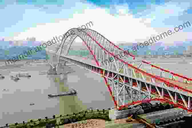 An Arched Steel Bridge Spanning Across A River, Connecting The Banks. Architecture And Construction In Steel